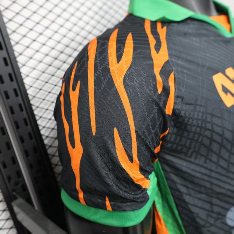 Player Version 2025 Ivory Coast Black with Elephant Graphic and Orange Stripes Jersey